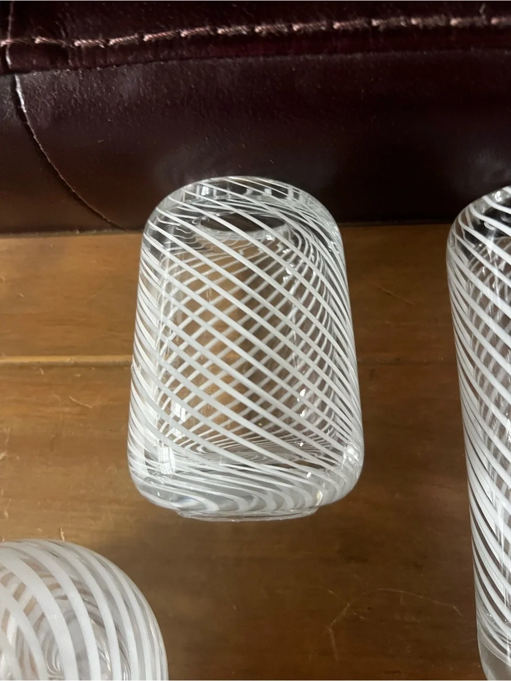 Set of three hand blown vases. Beautiful with white swirls.